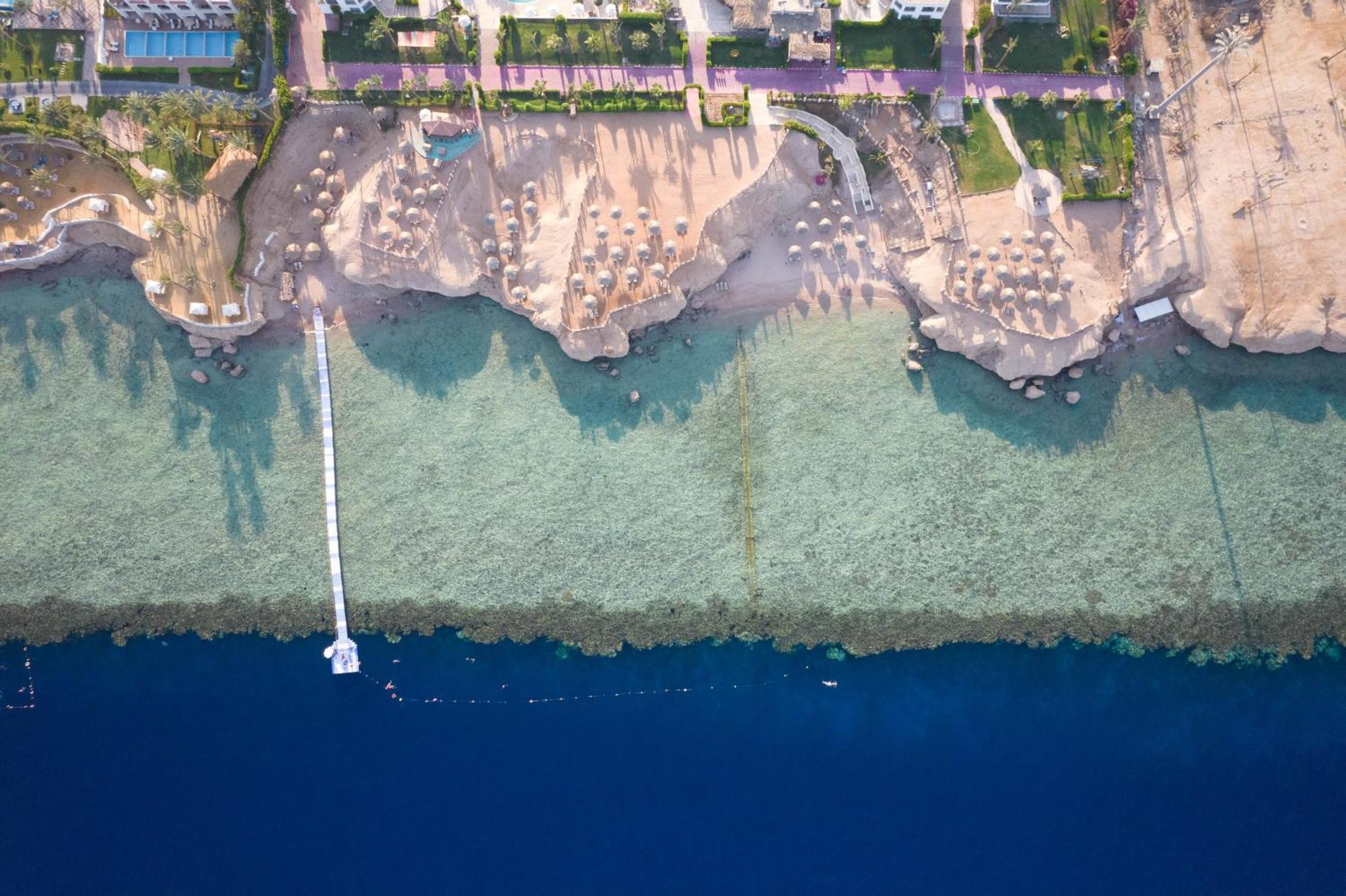 Safir Sharm Waterfalls Resort Exteriör bild Aerial view of the beach