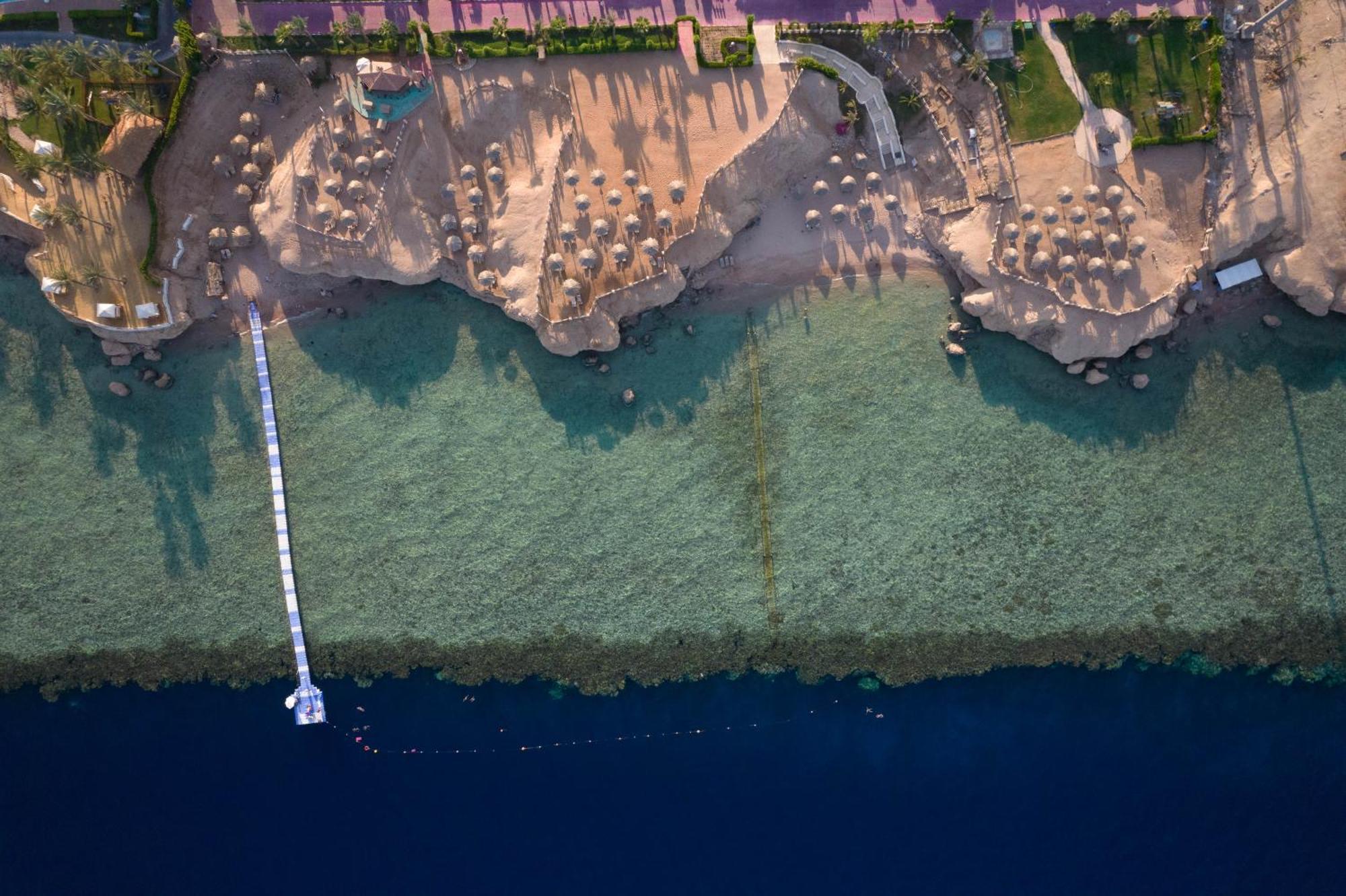 Safir Sharm Waterfalls Resort Exteriör bild Aerial view of the beach